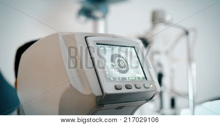 Ophthalmic equipment. In modern white medical laboratory.