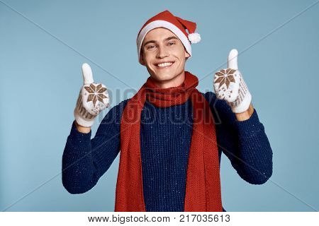 man in gloves shows two thumbs up, new year.