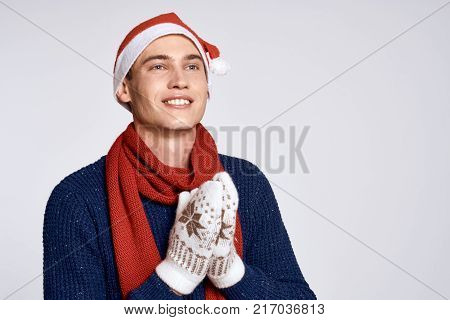 man in mittens, light background, portrait, winter, free space for copying.