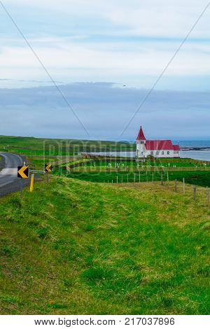 Countryside and a secluded church along the Hrutafjordur fjord in the west fjords region Iceland