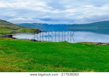 View of coastline and landscape along the Isafjordur fjord in the west fjords region Iceland