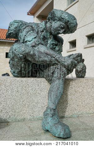 VALGA, SPAIN - SEPTEMBER 10, 2017: Pilgrim memorial in front of the pilgrim hostel of Valga on the Camino de Santiago trail on September 10, 2017 in Galicia, Spain