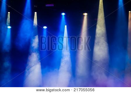 Concert stage. Beautiful Colourful disco lighting in the stage. Performance moving lighting. Concert Light Show. Stage Lights.