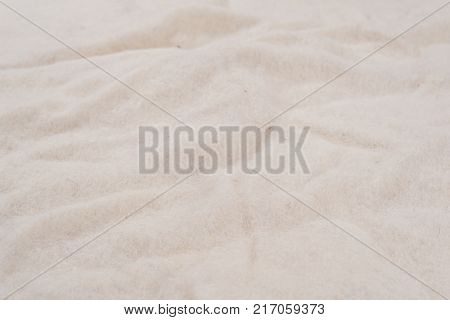 White background of non-woven natural woolen material