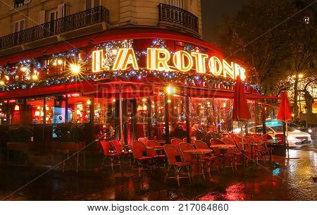 Paris, France - December 03, 2017: La Rotonde in the Montparnasse Quarter - one of the most legendary and the famous Parisian cafes. It is decorated for Christmas.
