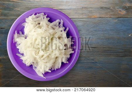 Daikon On A Wooden Background
