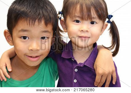 Japanese Brother And Sister Putting Arms Around Each Other's Sholders (8 Years Old Boy And 3 Years O