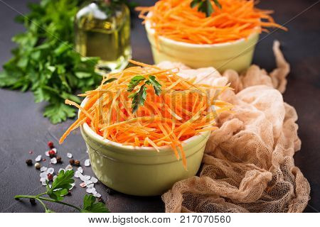Fresh carrot salad on bowls. Selective focus