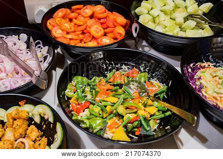 Closeup image of colorful Indian dish organized in self-service buffet. Vegetarian food concept