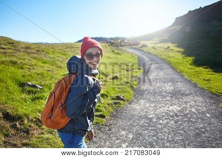 woman traveler on a walk in the Valley of the river of Hveragerdi Iceland. Hiking Tour of Reykjadalur Hot Springs