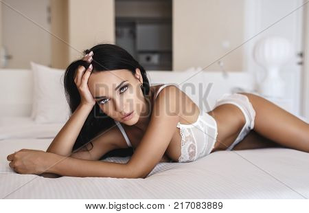 Beautiful young girl in a sexy white lingerie