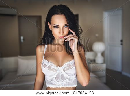 Beautiful young girl in a sexy white lingerie