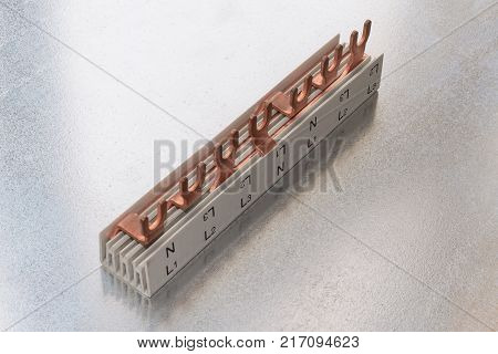 Part of the electrical connection busbar in a plastic case. Plastic does not conduct electricity. Busbar of copper. The pins in the plugs for the clamp screw. The shank facilitates the connection.