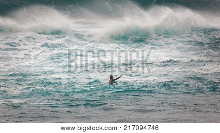 SUNSET BEACH HAWAII USA - DECEMBER 2, 2017: Competitive surfer in the waves at the 2017 Vans World Cup of Surfing competition at Sunset Beach on Oahu's scenic North Shore. This is the second of three surfing competitions and Conner Coffin took first place