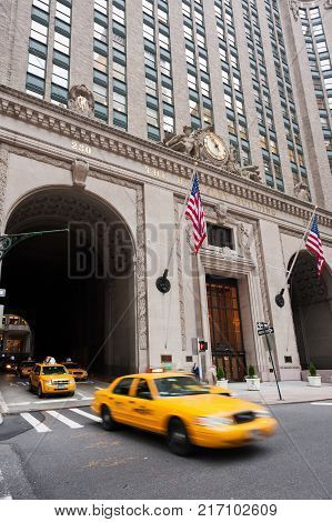 New York, USA - Nov 15, 2011 : Yellow taxis passing by the Helmsley building in New York City