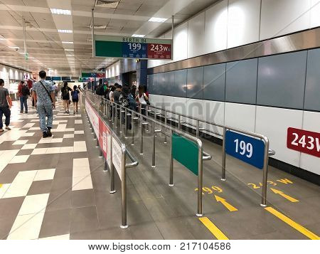 BOON LAY SINGAPORE - 29 NOV 2017: Many people waiting bus at the gate in Boon Lay bus station in Singapore