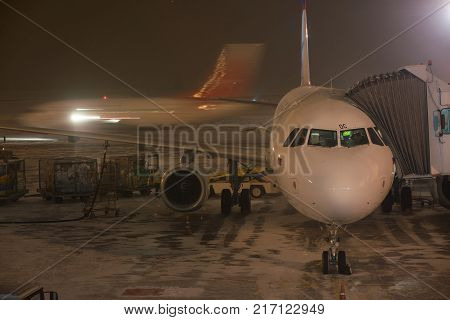 Novosibirsk, Russia - February 04, 2017: Airplane of Ural airlines preparing for flight in Tolmachevo airport. Airport is the largest Ural transit knot on the major directions between Europe and Asia.