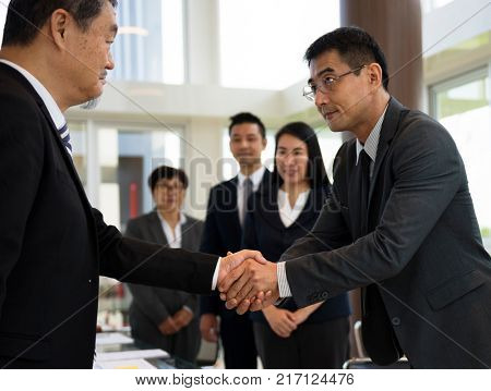 Business Partners Introductionary Handshake Bow