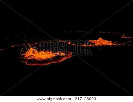 Erta Ale volcano crater melting lava splash Danakil depression Ethiopia