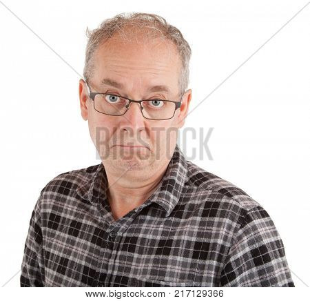 A stony-daced man is looking at the camera.
