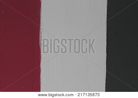Wall with gray - white - red lines detail of decoration in the city textured background