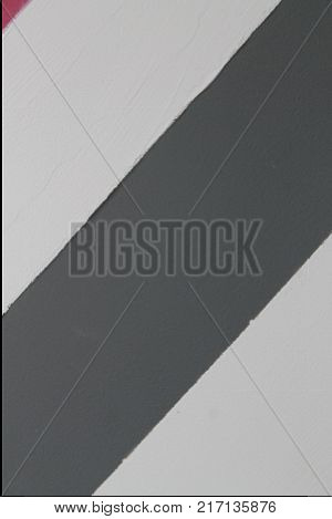 Wall with gray - white lines detail of decoration in the city textured background