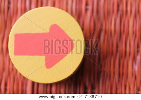 Traditional thai style nature background of brown handicraft weave texture wicker surface for furniture material with red arrow in yellow circle
