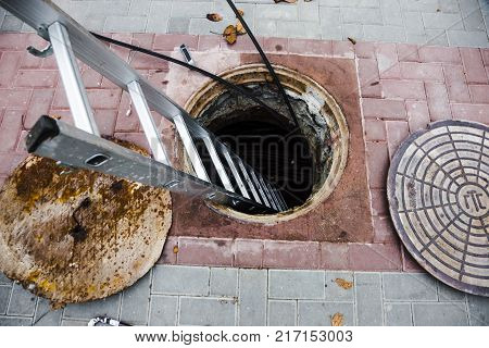 open hatch with stairs inside repair work