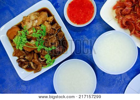 Pork chitterlings in the sweet gravy served with boiled rice Thai cuisine.