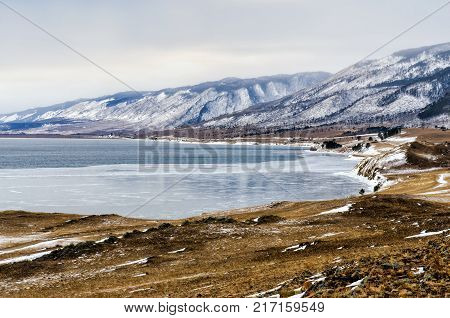 View above big beautiful lake and mountain in winter, Baikal lake, Russia, Siberia