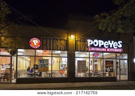 Toronto Canada - Oct 19 2017: Popeyes Louisiana Kitchen fast food restaurant illuminated at night.