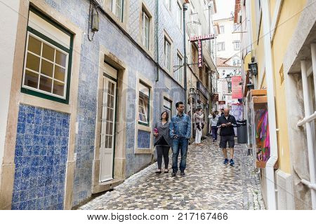 SINTRA, PORTUGAL - 03 JUNE, 2017: People walking in the Rua das Padaria in the center of the city. The area contains typical bakeries and shops.