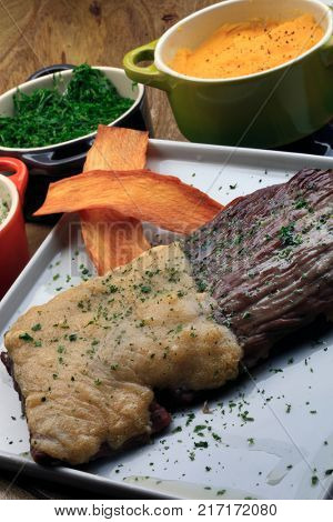 Roasted meat with rice, farofa and kale
