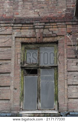 Abandoned old house. Ancient windows in the house.