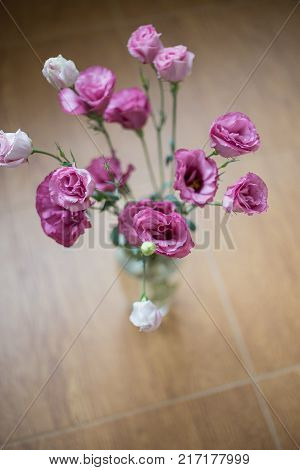 beautiful bouquet of bright pink flowers in a vase eustoma