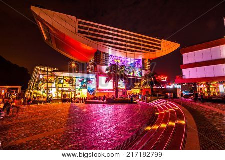Hong Kong, China - December 7, 2016: The Peak Tower, iconic landmark, atop Victoria Peak by night. The Peak Tower is the most popular attraction in Hong Kong and the island's highest viewing platform.