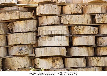 Wood Background Texture. Cross Section Of Tree Trunk. Spili Trees Stumps Stacked In Stacks. Used For