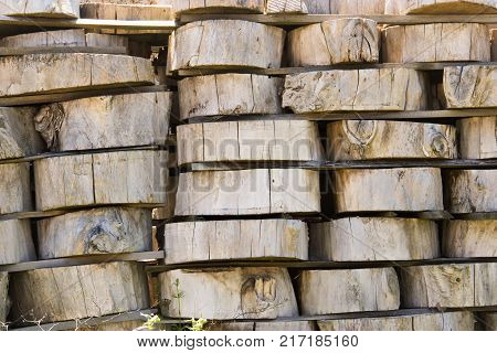 Wood Background Texture. Cross Section Of Tree Trunk. Spili Trees Stumps Stacked In Stacks. Used For