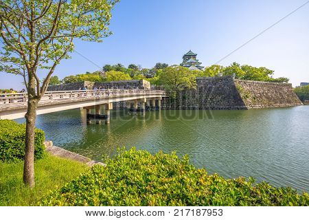 Moat around Osaka Castle and Gokurakubashi Bridge, one of most famous landmarks of Japan and icon of Osaka city. Beautiful view in spring time a sunny day.