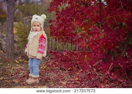 Cute Young Russian Baby Girl Stylish Dressed In Warm White Fur Handmade Jacket Blue Jeans Boots And 