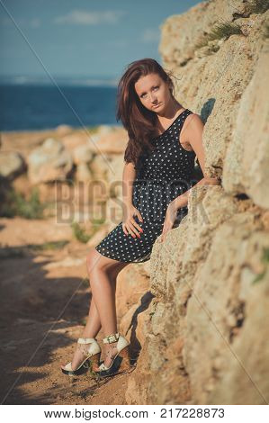 Hot Sexy Stylish Dressed Young Lady Brunette Hairs And Pinky Cheeks With Open Legs Shoulders And Arm