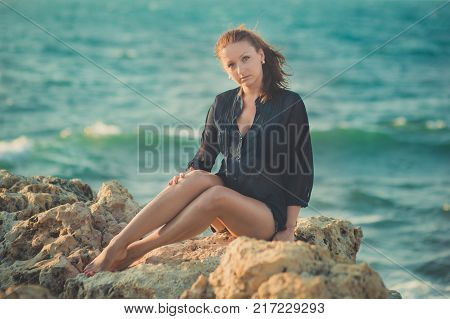 Hot Sexy Stylish Dressed Young Lady Brunette Hairs And Pinky Cheeks With Open Legs Shoulders And Arm