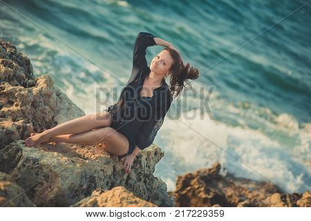 Hot Sexy Stylish Dressed Young Lady Brunette Hairs And Pinky Cheeks With Open Legs Shoulders And Arm