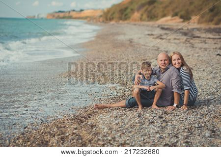 Lovely Amazing Scene Of Happy Family Of Handsome Father Beautiful Lady Mother And Cute Little Son Bo