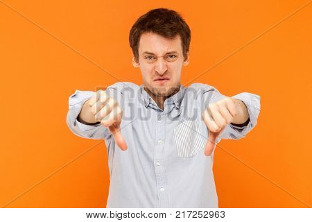 Bad Sign. Man Showing Dislike At Camera And Have Sadness Look