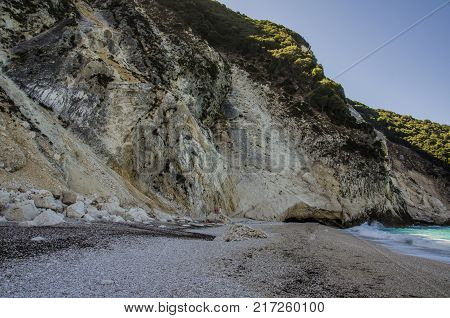The famous and paradisiacal beach of Myrtos in Kefalonia is surrounded by mountains Agia Dynati and Kalos Oron of up to nine hundred meters of height that fall chopped on it creating a scenographic environment