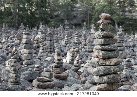 Area in the forest covered with many mysterious piles of stones in the village Geta on the island Aaland part of Finland in northern Europe