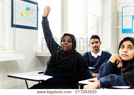 Diverse Muslim children studying in a classroom