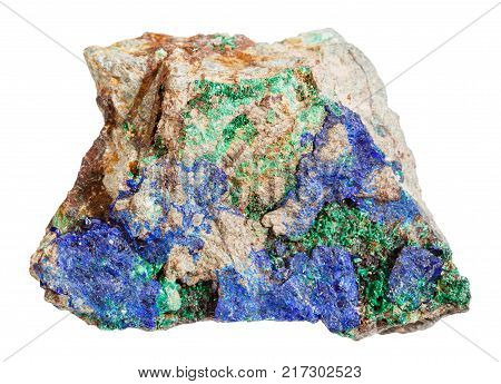 macro shooting of natural mineral rock specimen - blue Azurite and green Malachite on rough stone isolated on white background from Ural Mountains, Russia