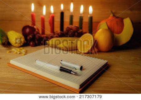 Kwanzaa Holiday Concept With Decorate Seven Candles Red, Black And Green, Gift Box, Pumpkin,corn And